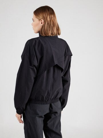 Reebok Sports jacket in Black