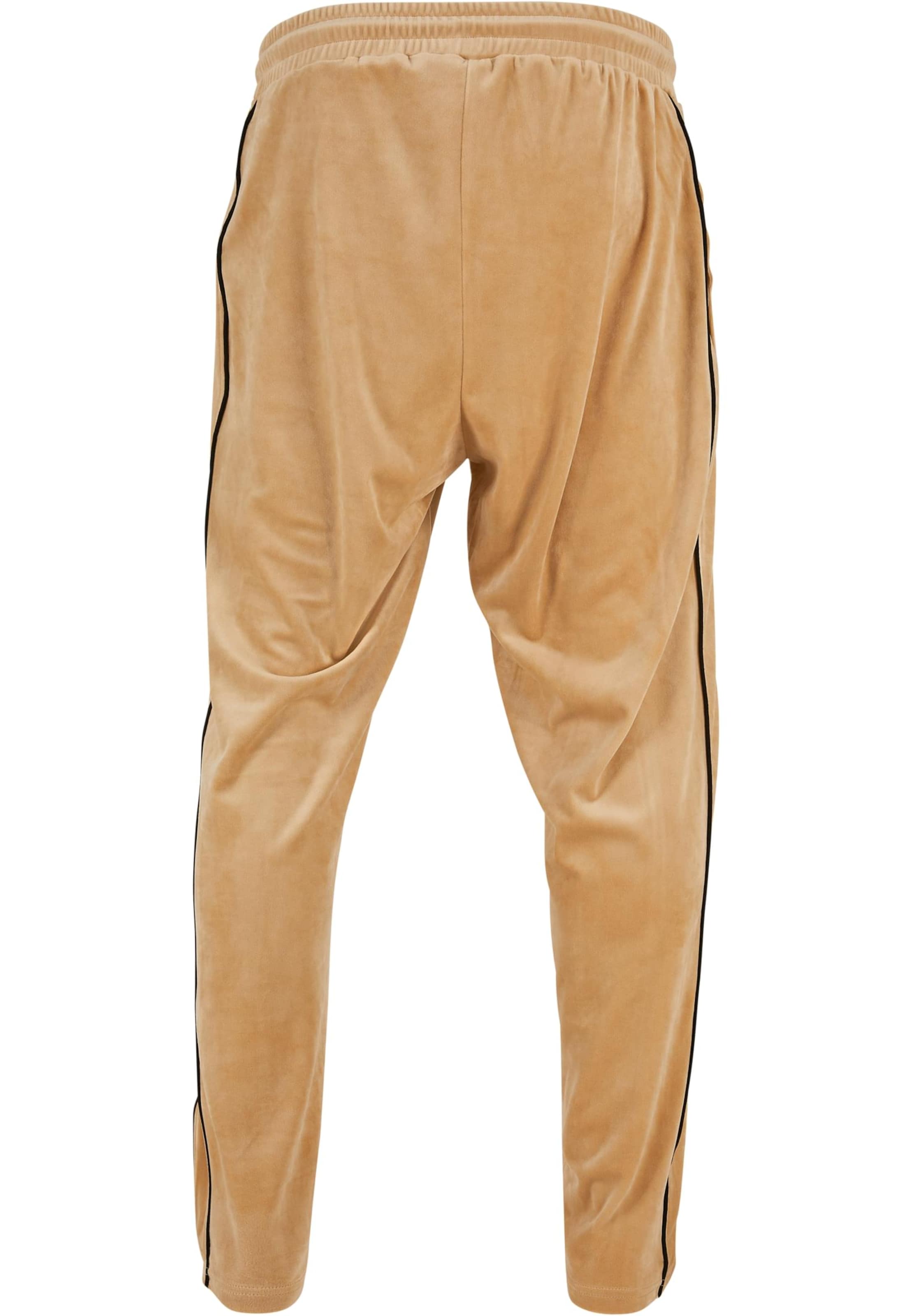 Karl Kani Regular Trousers in Beige