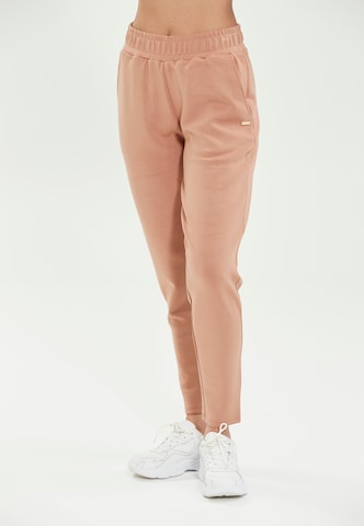 Athlecia Tapered Workout Pants in Beige: front