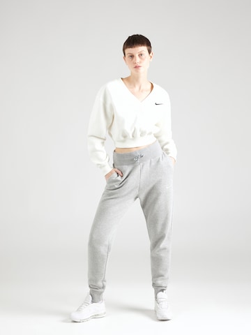 Tapered Pantaloni di Nike Sportswear in grigio