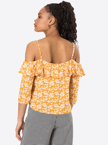 ABOUT YOU - Blusa 'Jeanette' em amarelo