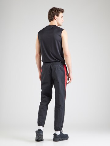 Reebok Tapered Sports trousers in Black