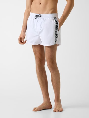 GUESS Board Shorts in White: front