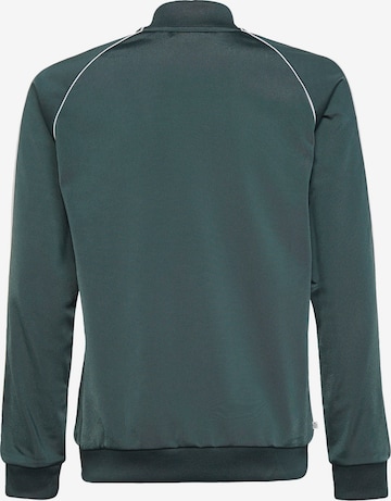 ADIDAS ORIGINALSregular Prijelazna jakna 'Adicolor Sst' - zelena boja