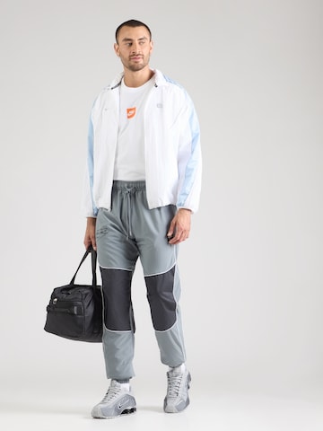 Nike Sportswear Zwężany krój Spodnie 'AIR' w kolorze szary