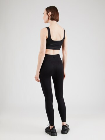 Skinny Pantaloni sportivi di 4F in nero