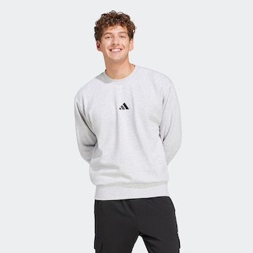 ADIDAS SPORTSWEAR Sports sweatshirt 'FEELCOZY' in Grey: front