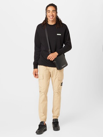Calvin Klein Jeans Tapered Cargo trousers in Beige
