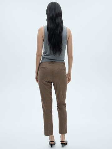 MANGO Skinny Pressveckad byxa i röd