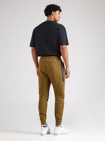 Effilé Pantalon 'TCH FLC' Nike Sportswear en vert
