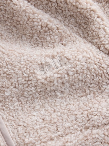 Pull-over self. en beige
