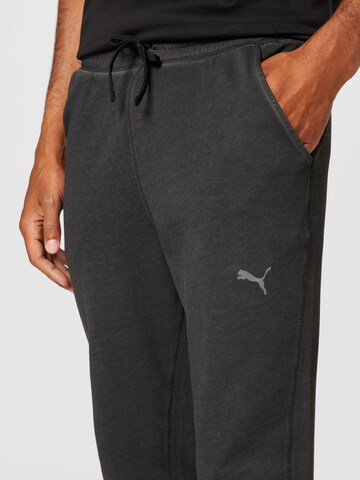 Effilé Pantalon de sport PUMA en noir