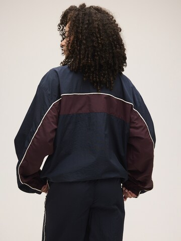 Giacca di felpa 'FERRARA oversized blocked woven track jacket' di FILA in blu