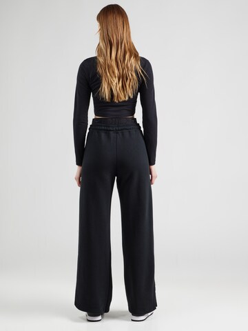 Wide leg Pantaloni 'PHNX FLC' di Nike Sportswear in nero