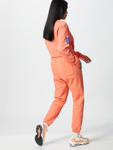 ABOUT YOU x Mero Loosefit Broek 'Code' in Oranje