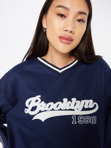 Sweat-shirt Edikted en bleu