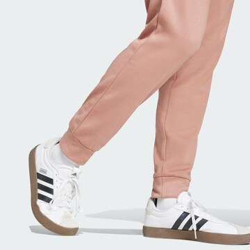 ADIDAS SPORTSWEAR Tapered Workout Pants 'Essentials Feelcozy' in Pink