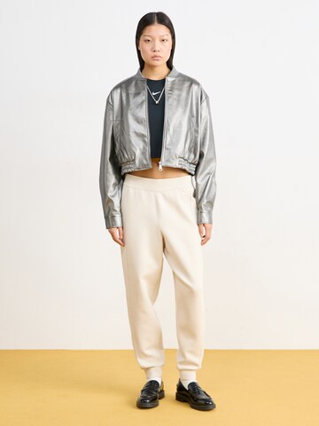 NIKE Tapered Παντελόνι φόρμας '24.7' σε μπεζ