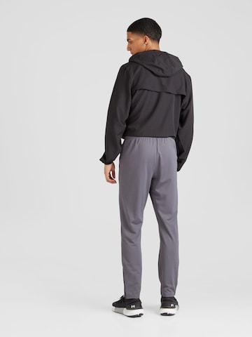 regular Pantaloni sportivi di UNDER ARMOUR in grigio