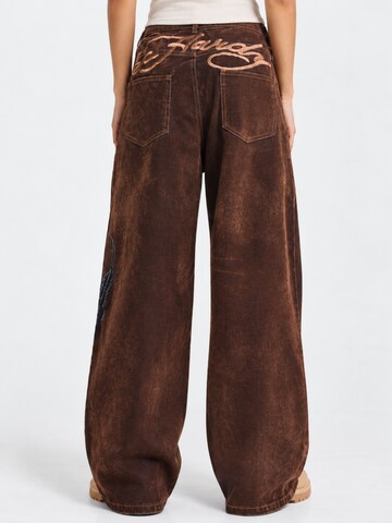 Ed Hardy Wide leg Jeans 'Signature Eagle' in Bruin: voorkant