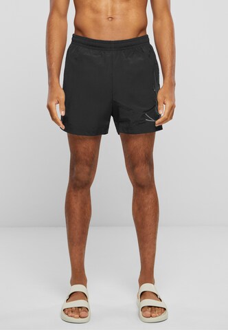 Karl Kani Loose fit Swimming shorts in Black: front