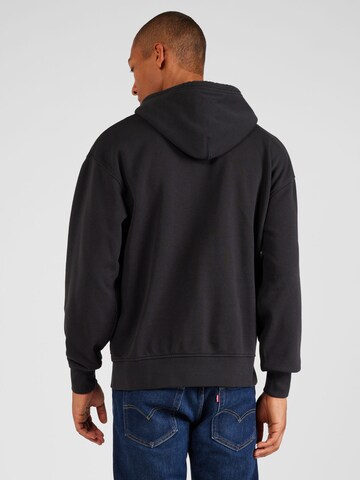 LEVI'S ®Regular Fit Sweater majica 'Relaxed Graphic Hoodie' - crna boja