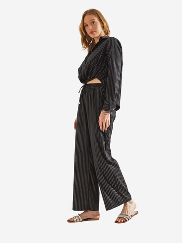 Bianco Lucci - Perna larga Calças em preto