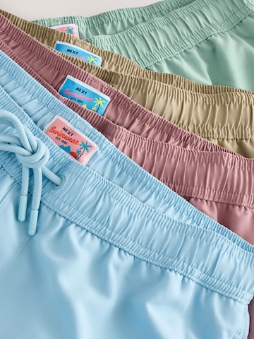 Next Uimashortsit 'Essential' värissä beige