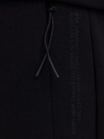 Bershka Tapered Hose in Schwarz