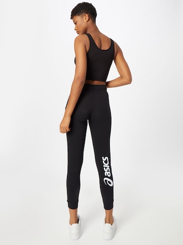 Effilé Pantalon de sport ASICS en noir