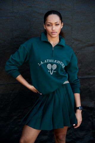 LASCANA ACTIVE Sportovní sukně – zelená