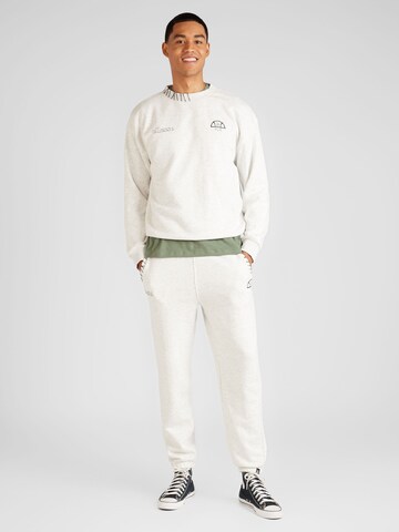 ELLESSE - Tapered Calças de desporto 'Nevica' em branco