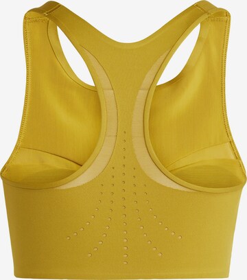 Bustino Top sportivo di ADIDAS BY STELLA MCCARTNEY in giallo