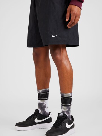 Nike Sportswear Regular Pants 'Solo Swoosh' in Black