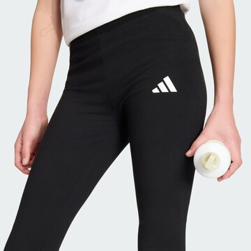 Flared Pantaloni sportivi 'Essentials' di ADIDAS SPORTSWEAR in nero