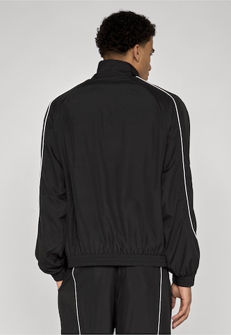 Urban Classics Between-season jacket 'Extra Volume' in Black