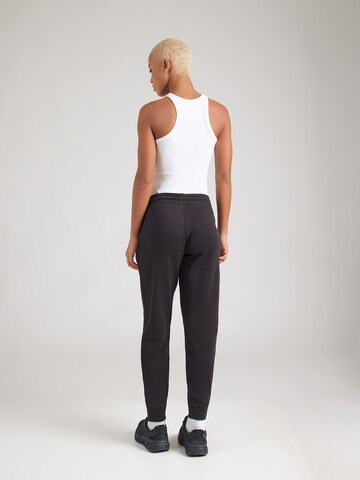 PUMA Конический (Tapered) Спортивные штаны 'Ess' в Черный