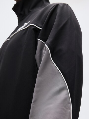 PUMA Trainingspak in Zwart