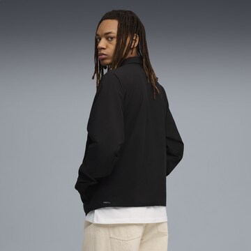 PUMA Sportsweatshirt 'Pumatech' in Zwart
