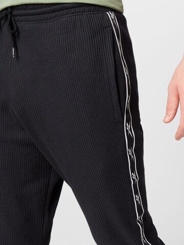 Reebok Zúžený Sportovní kalhoty – černá