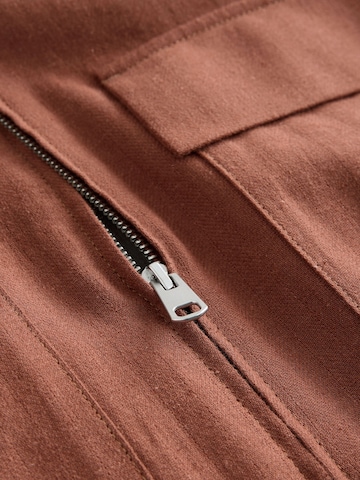 Next Tussenjas in Bruin