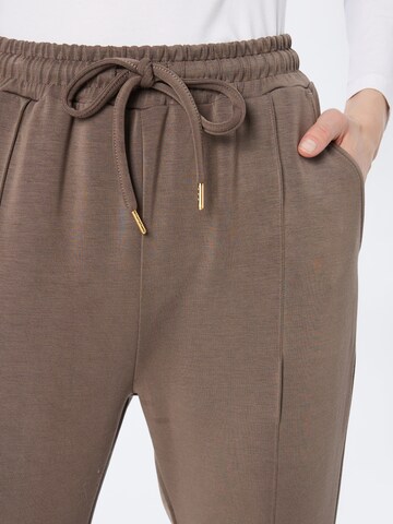 Athlecia Skinny Workout Pants 'Jacey' in Brown