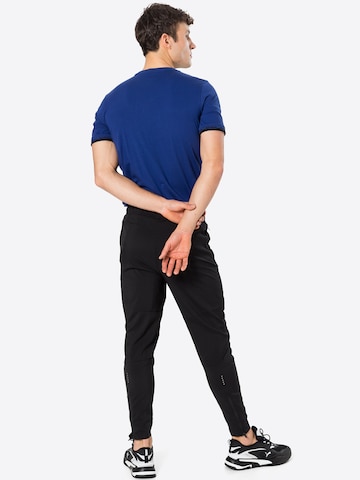 PUMA Tapered Sportbroek in Zwart