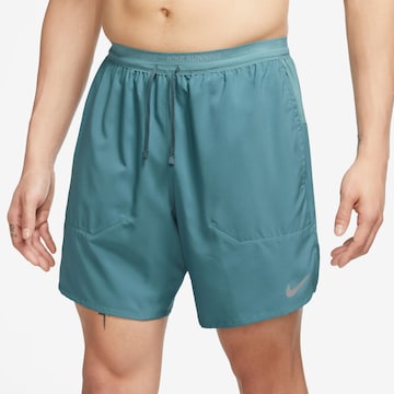 NIKE Regular Workout Pants in Blue: front