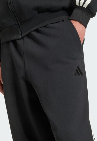 ADIDAS SPORTSWEAR Lużny krój Spodnie sportowe w kolorze czarny
