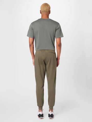 UNDER ARMOUR Tapered Sporthose in Grün