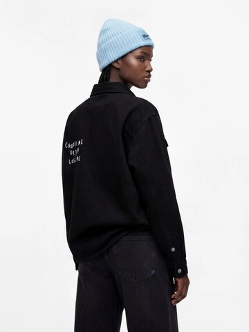 KARL LAGERFELD JEANS Välikausitakki 'X Pietro Terzini' värissä musta