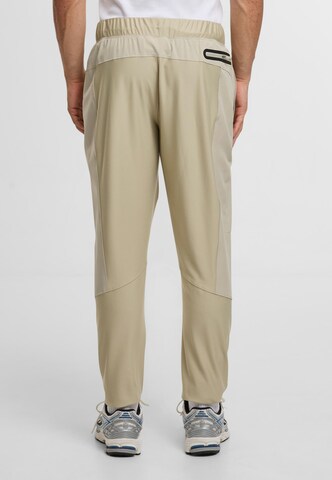 Sergio Tacchini Tapered Urheiluhousut 'Pelle' värissä harmaa