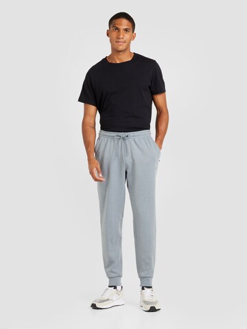 Effilé Pantalon de sport 'PRIMARY' NIKE en gris