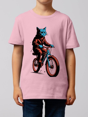 Maglietta ' Katze auf Fahrrad ' di watabout.kids in rosa: frontale